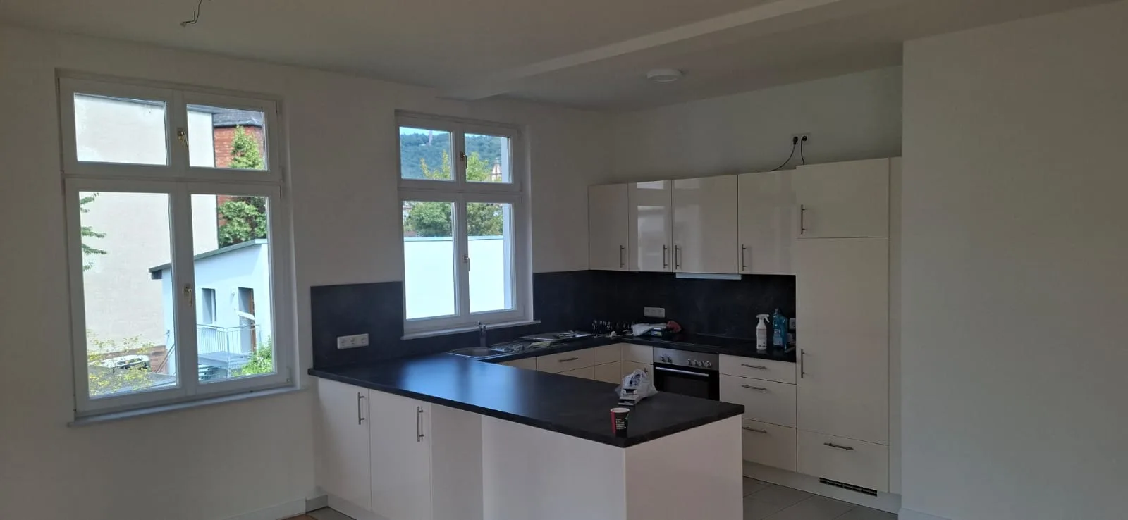 Fitted kitchen freshly painted with a view over the town